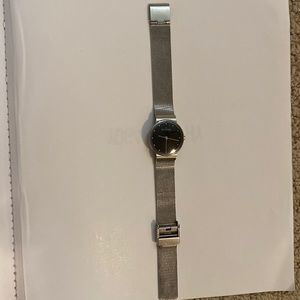 Skagen stainless steel mesh band with black face.